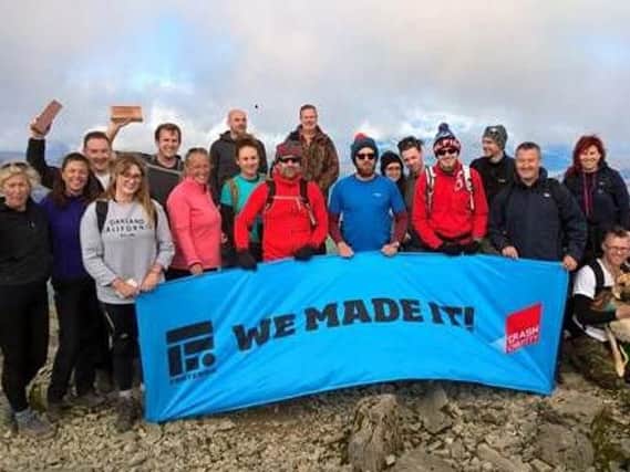 18 Forterra employees from the firms facilities around the UK, and Stella the Alsatian, conquered the UKs highest peak.