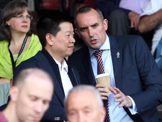 Kelvin Thomas, right, says the borough council is holding up a development of the Sixfields East Stand.