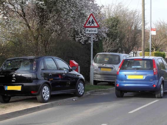 A Labour motion to kerb school parking and traffic problems was voted down by councillors.