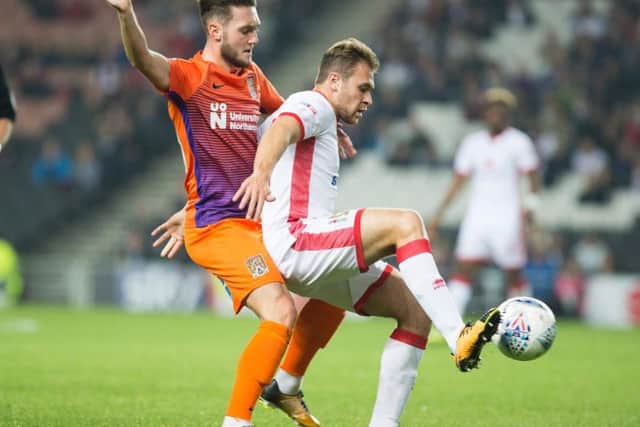 Matt Grimes battles for possession at MK Dons (Pictures: Kirsty Edmonds)
