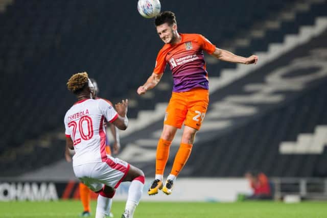 Matt Grimes wins this aerial battle