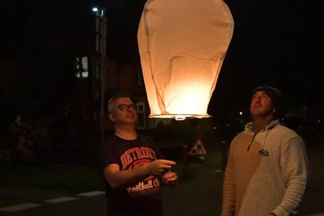 David's sons Gary and Dale lit the first lantern.