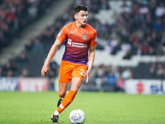 Regan Poole in action for the Cobblers at MK Dons on Tuesday (Picture: Kirsty Edmonds)