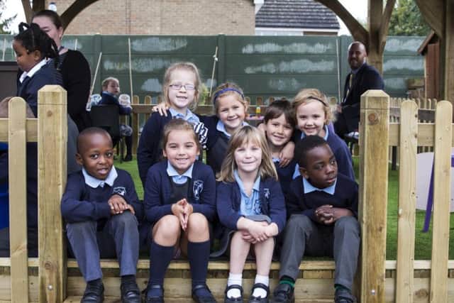 Pupils model the new outdoor classroom at Collingtree C of E Primary School.