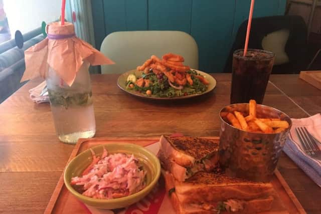 Supervital Green Salad with a chill squid add-on (10.50) and Kingston PullPork Toastie with Caribbean slaw & fries(7).