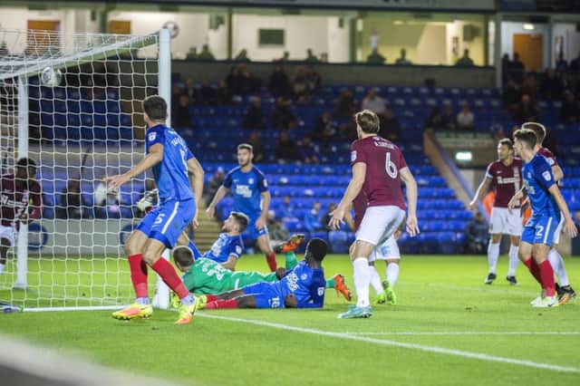 The moment the Cobblers finally ended their 490-minute barren run in front of goal. Pictures: Kirsty Edmonds
