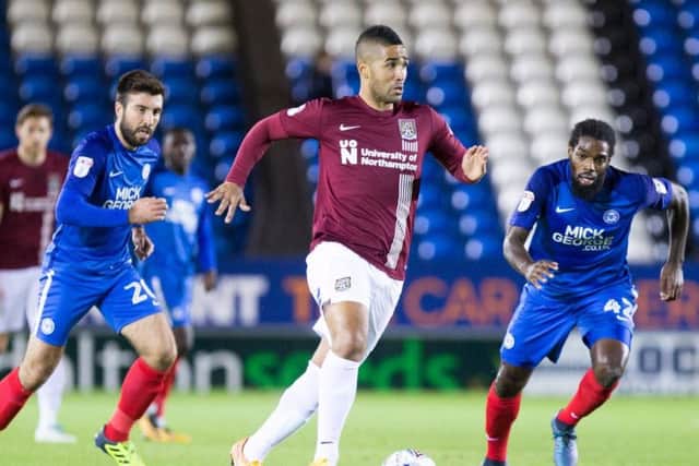 Debutant Lewis McGugan in action for the Cobblers against Peterborough (Pictures: Kirsty Edmonds)