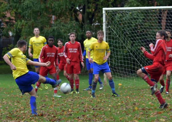 LETTING FLY - action from the Sunday Conference clash between Queens Park and Denton (Pictures: Dave Ikin)