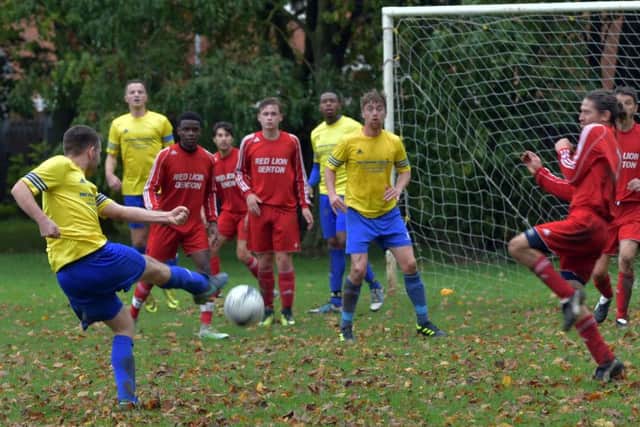 LETTING FLY - action from the Sunday Conference clash between Queens Park and Denton (Pictures: Dave Ikin)