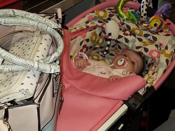 Five-month-old Scarlett had to be placed on top of suitcases in the isle of the carriage.