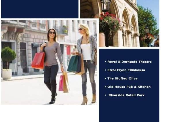 Two women are pictured shopping the Martin Grant Homes brochure, but they do not appear to be on a Northampton street.