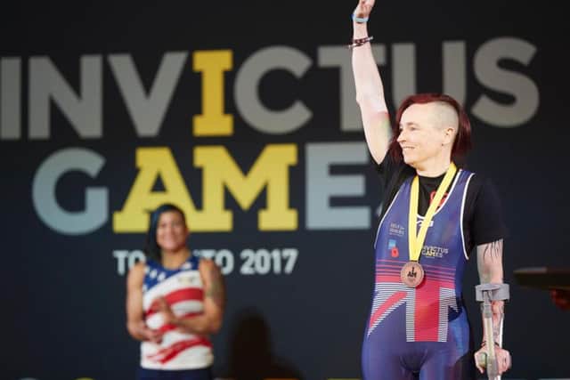 Kerys receiving her medal in Toronto.