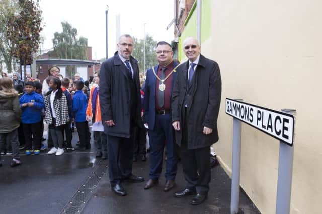 L-R: Chair of St James residents association, Graham Croucher, the mayor of Northampton, councillor Gareth Eales and Eliza Gammons' great-great grandson, Wayne Casey stand next to the newly unveiled street sign.