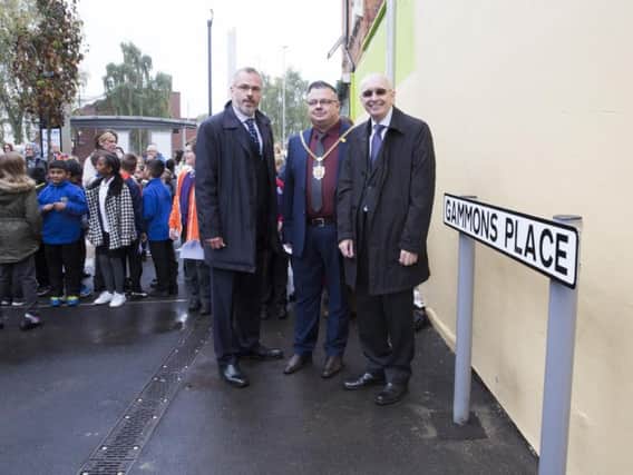 L-R: Chair of St James residents association, Graham Croucher, the mayor of Northampton, councillor Gareth Eales and Eliza Gammons' great-great grandson, Wayne Casey stand next to the newly unveiled street sign.