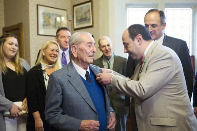 The Honourary Consul of France awarding George Verden with the Lgion d'Honneur medal at the Mayor's Office at Northampton Guildhall.