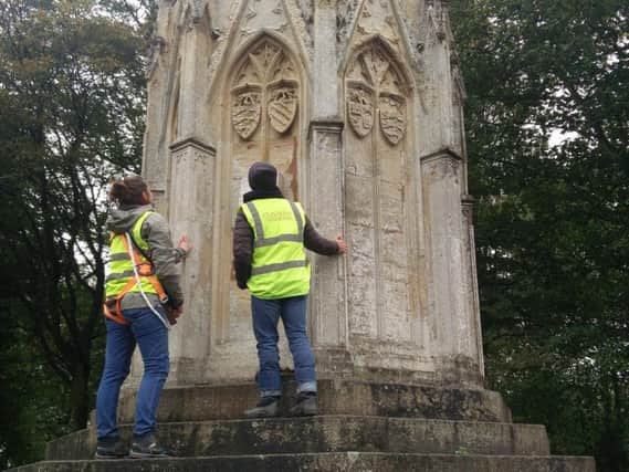 Surveyors examine the 13th-Century Eleanor Cross, in London Road.