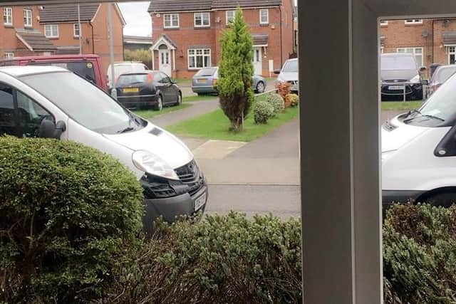 The view from on man's window after vans blocked his driveway today. "It's been going on like this for months."
