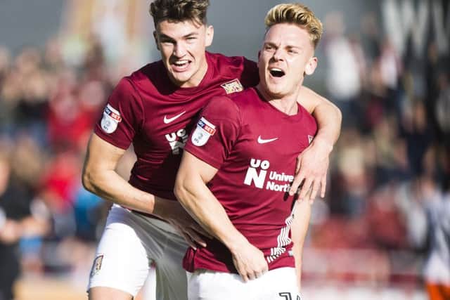 GET IN THERE! - Sam Hoskins celebrates scoring the winner against Blackpool (Pictures: Kirsty Edmonds)