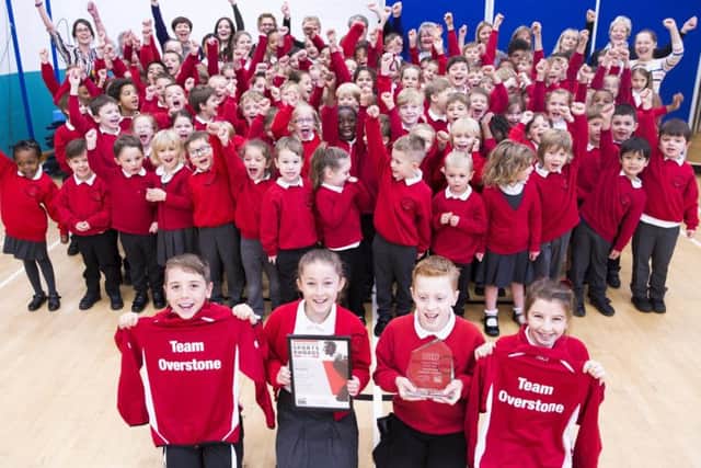 The school shows off its award (and new tracksuits).