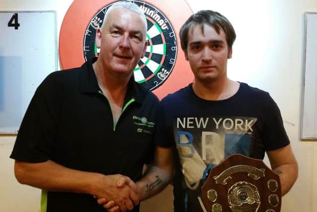 WELL DONE - Jonathan Wood (right) collects his trophy from runner-up Neil Culley