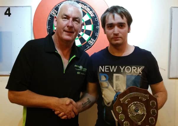 WELL DONE - Jonathan Wood (right) collects his trophy from runner-up Neil Culley