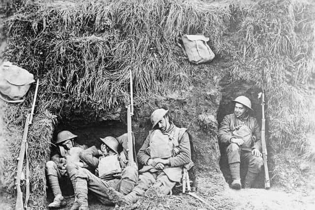 Troops of the 1st Battalion, Northamptonshire Regiment resting in a front-line trench at Molain, October 17, 1918