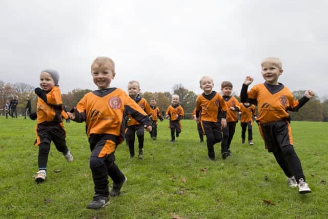 The lads of the Little Lions football group in their new kit.