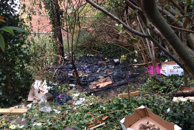 The burnt remains of the tent by the Boots alley off Market Square.