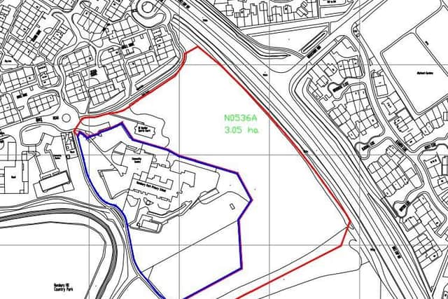 An acre-and-a-half of scrubland, outlined in red, has been proposed for up to 50 houses.