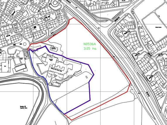An acre-and-a-half of scrubland, outlined in red, has been proposed for up to 50 houses.