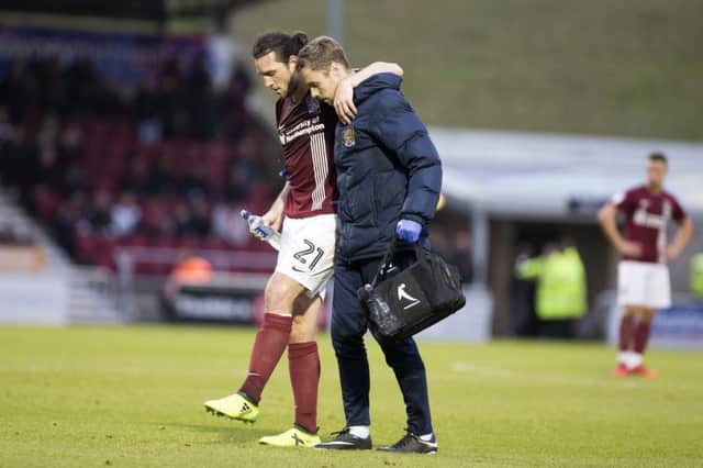 John-Joe O'Toole struggled to put any weight on his left leg when being helped off the field on Saturday. Picture: Kirsty Edmonds