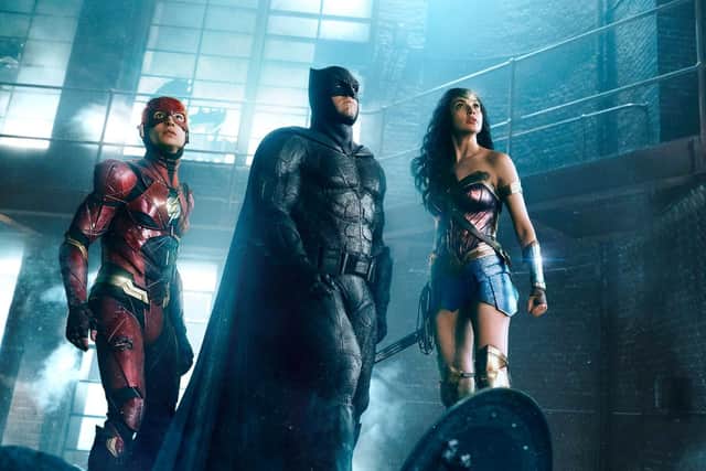 Ezra Miller as Flash, Ben Affleck as Batman and Gal Gadot as Wonder Woman