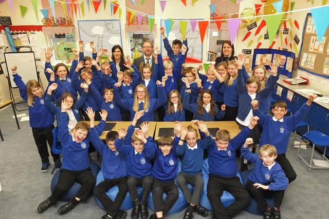 Back row, L-R: assistant teacher, Sarah McErlean, middle, year six teacher, Tim Crouch and right, head teacher, Jodie Matthews with John Hellins' year six class.
