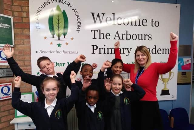 Pupils at The Arbours celebrate the latest "good" rating.
