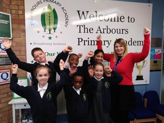 Pupils at The Arbours celebrate the latest "good" rating.
